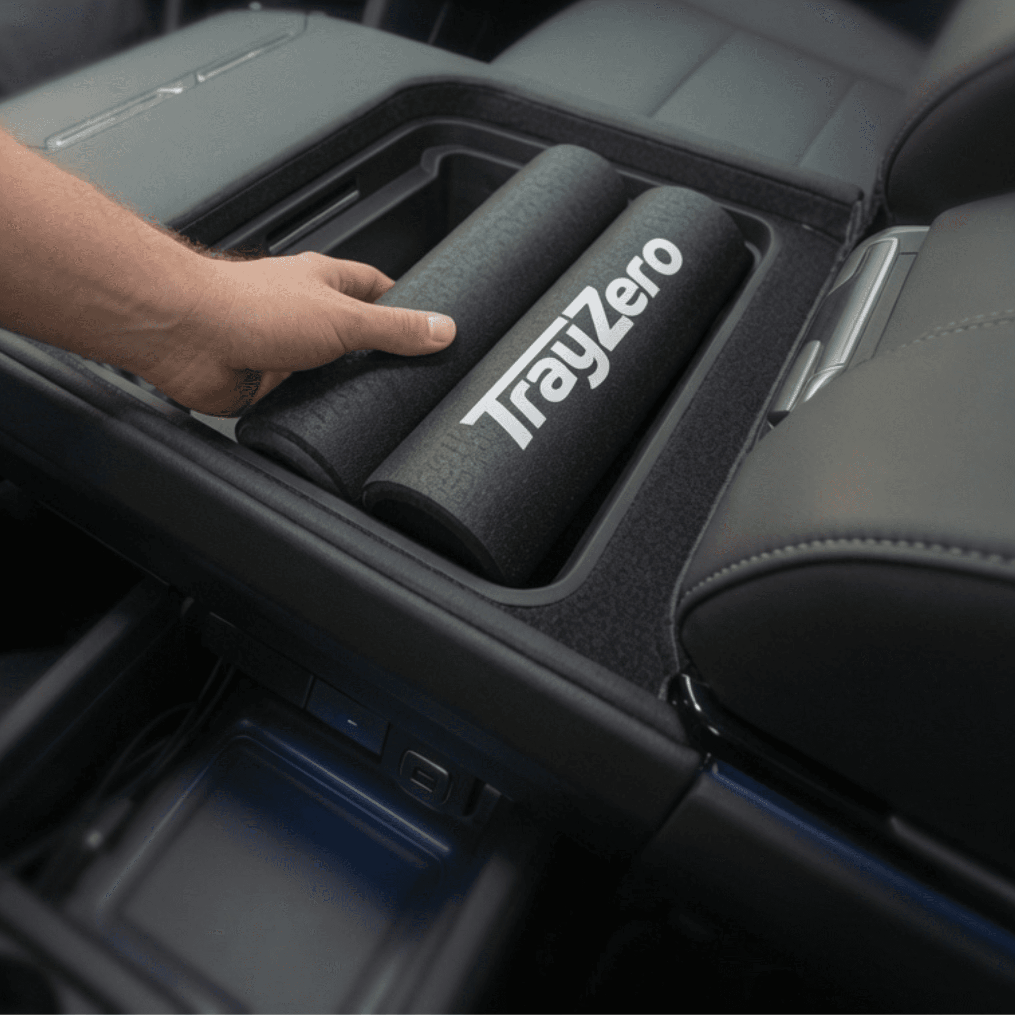 TrayZero padded supports stored compactly in a vehicle center console